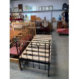 A Victorian brass and iron single bedframe