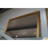 A gilt framed wall mirror