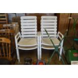 Four plastic garden chairs