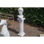 A concrete garden bust on plinth