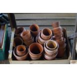 A quantity of various terracotta plant pots