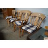 A set of four spindle back chairs to include one c