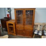 A pine and leaded glazed display cabinet together
