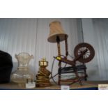 A table lamp in the form of a spinning wheel and o