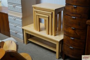 A beech coffee table and a nest of three occasiona