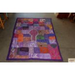An approx. 4'5" x 3'1" patchwork wall hanging