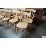 A set of four spindle bar back chairs to include t