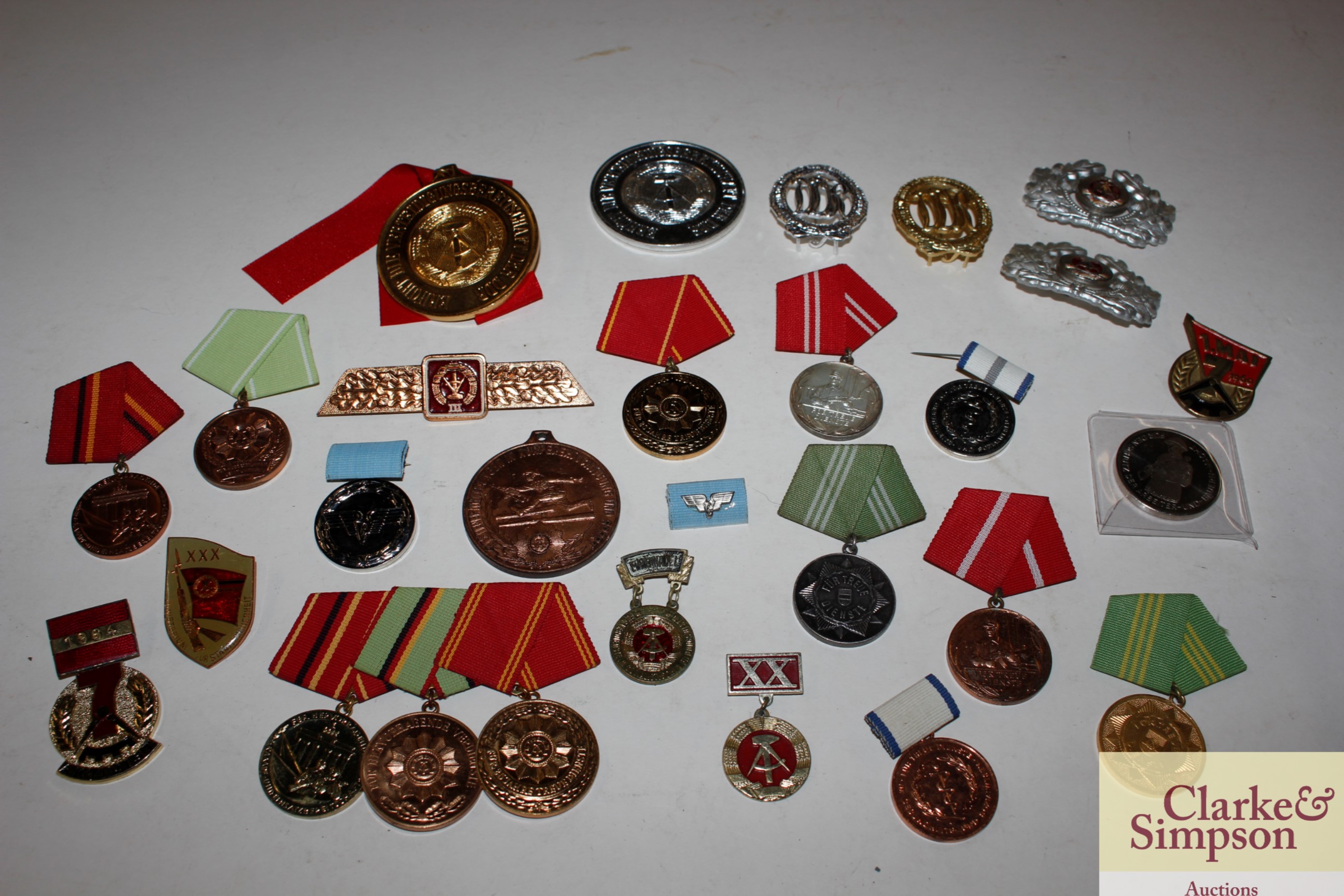 A box of various East German medals