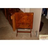 An early 20th Century oak and inlaid folding table