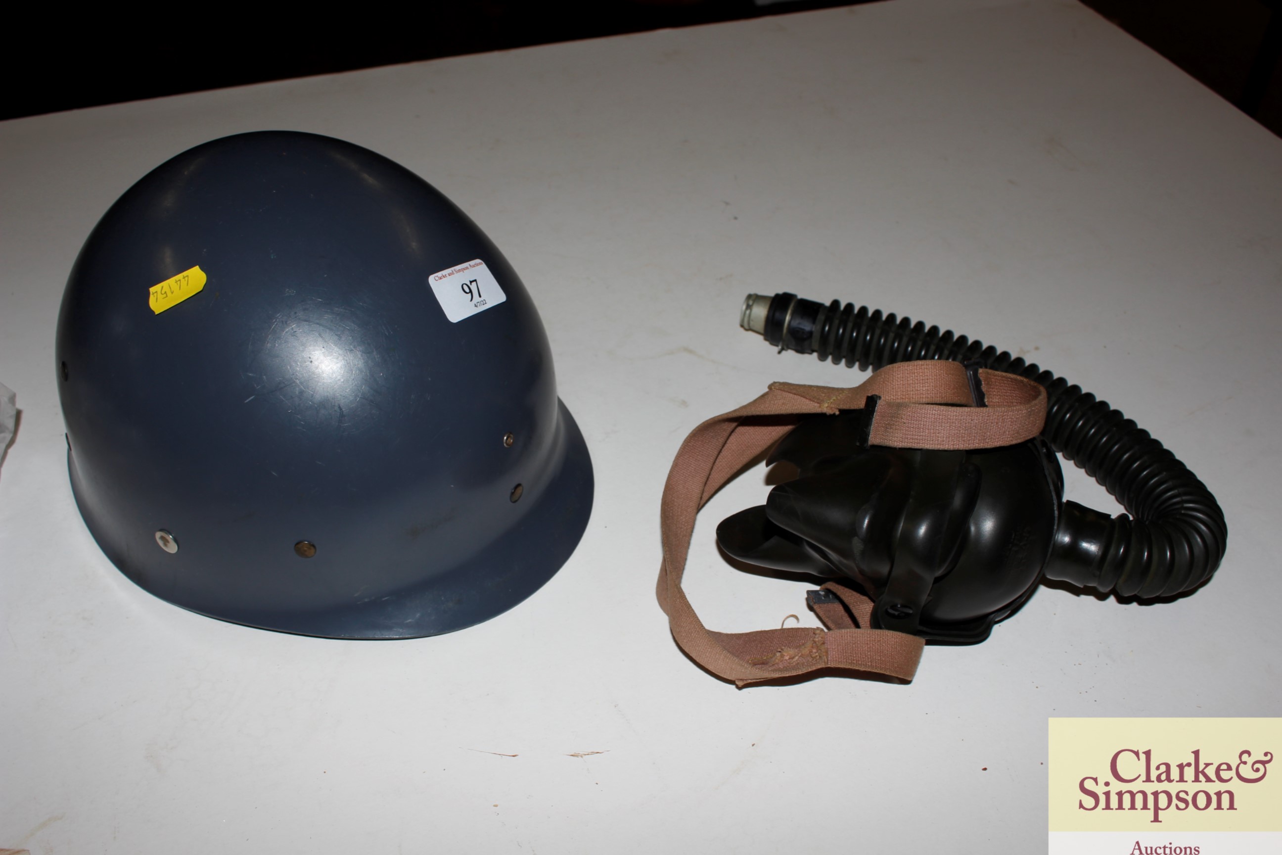 A USAAF pilots oxygen mask; and a military helmet