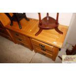 A pair of good quality oak three drawer bedside ch
