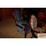 A Victorian mahogany spoon back armchair