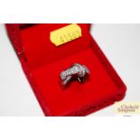A 925 knot style ring set white stones in red box