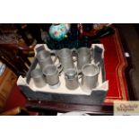 Seven various pewter mugs and an egg cup