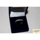 A 925 and green stone set ring