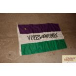 A copy of a Votes For Women Suffragette flag