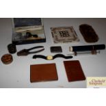 A jewellery cleaning kit, a leather wallet, a vest