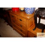 A good quality modern oak chest of two short and t