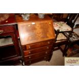 A reproduction mahogany bureau