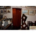 An Edwardian inlaid mahogany corner cupboard