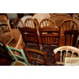 A pair of Edwardian carved walnut dining chairs