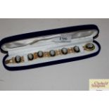 A boxed mother of pearl cameo bracelet