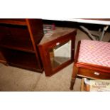 A mahogany hanging corner cupboard with mirrored p