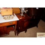 A walnut bedside cabinet