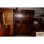 A large reproduction mahogany three door bookcase