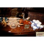 A mantel timepiece and a pottery model dray horse and cart
