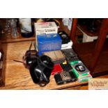 Various vintage cameras and accessories