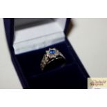 A 925 blue stone set flower ring