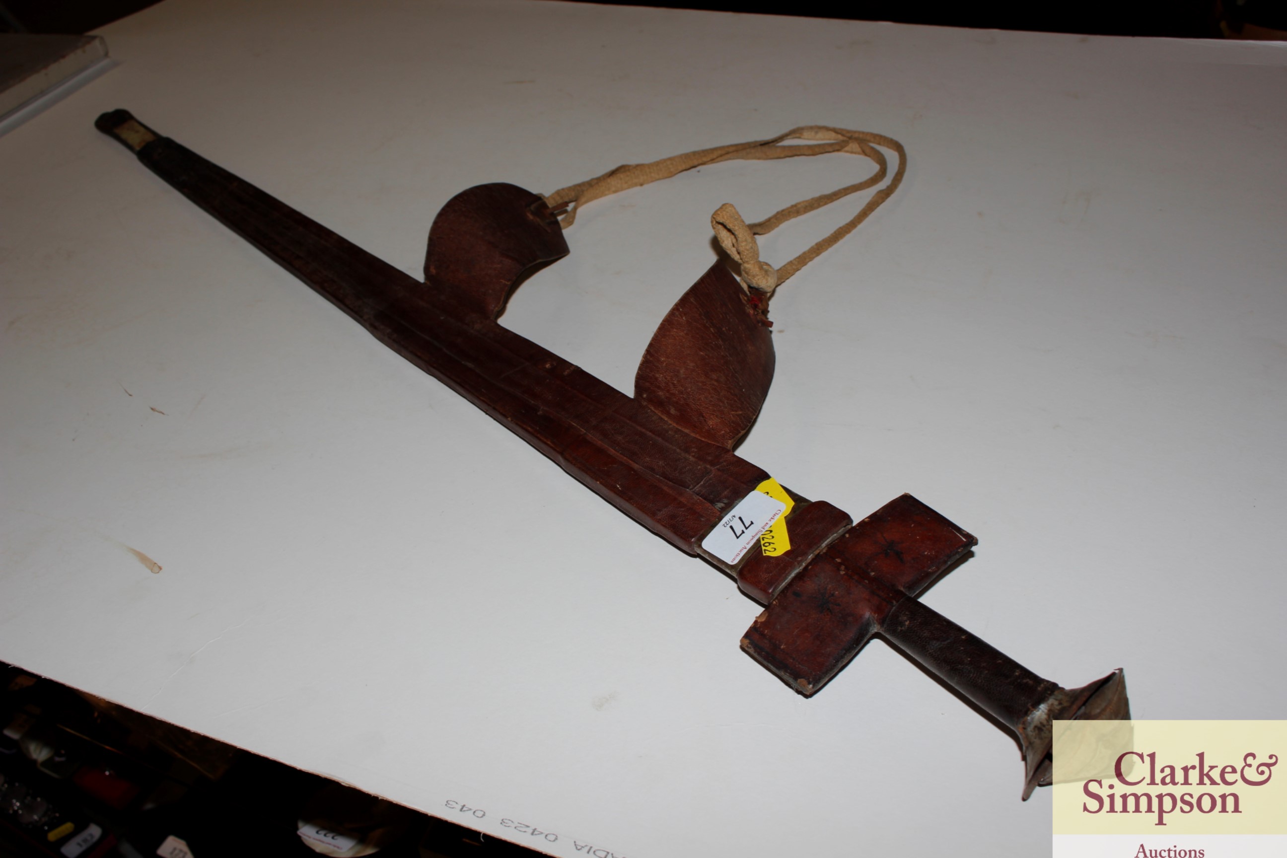 An antique leather covered Kris type sword
