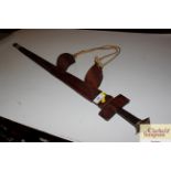 An antique leather covered Kris type sword