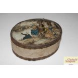 An antique oval card and silk covered powder box,