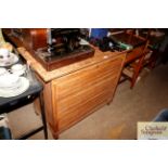 An oak chest of three long drawers