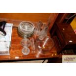 Three glass carafes, fruit bowls etc.