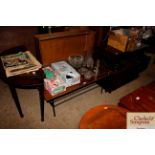 A retro hardwood coffee table on metal base