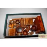 A box containing various treen items