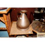 An antique copper two gallon jug