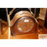 A 1930's oak cased two hole mantel clock