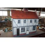 A large dolls house lacking contents