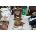 A late Victorian American mantel clock and a cucko