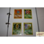 A folder containing circa 1999 Pokémon cards and later
