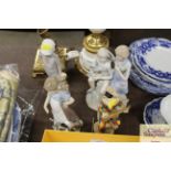 A Lladro figurine of a girl with kittens; a Nao wa