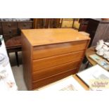 A teak five drawer chest