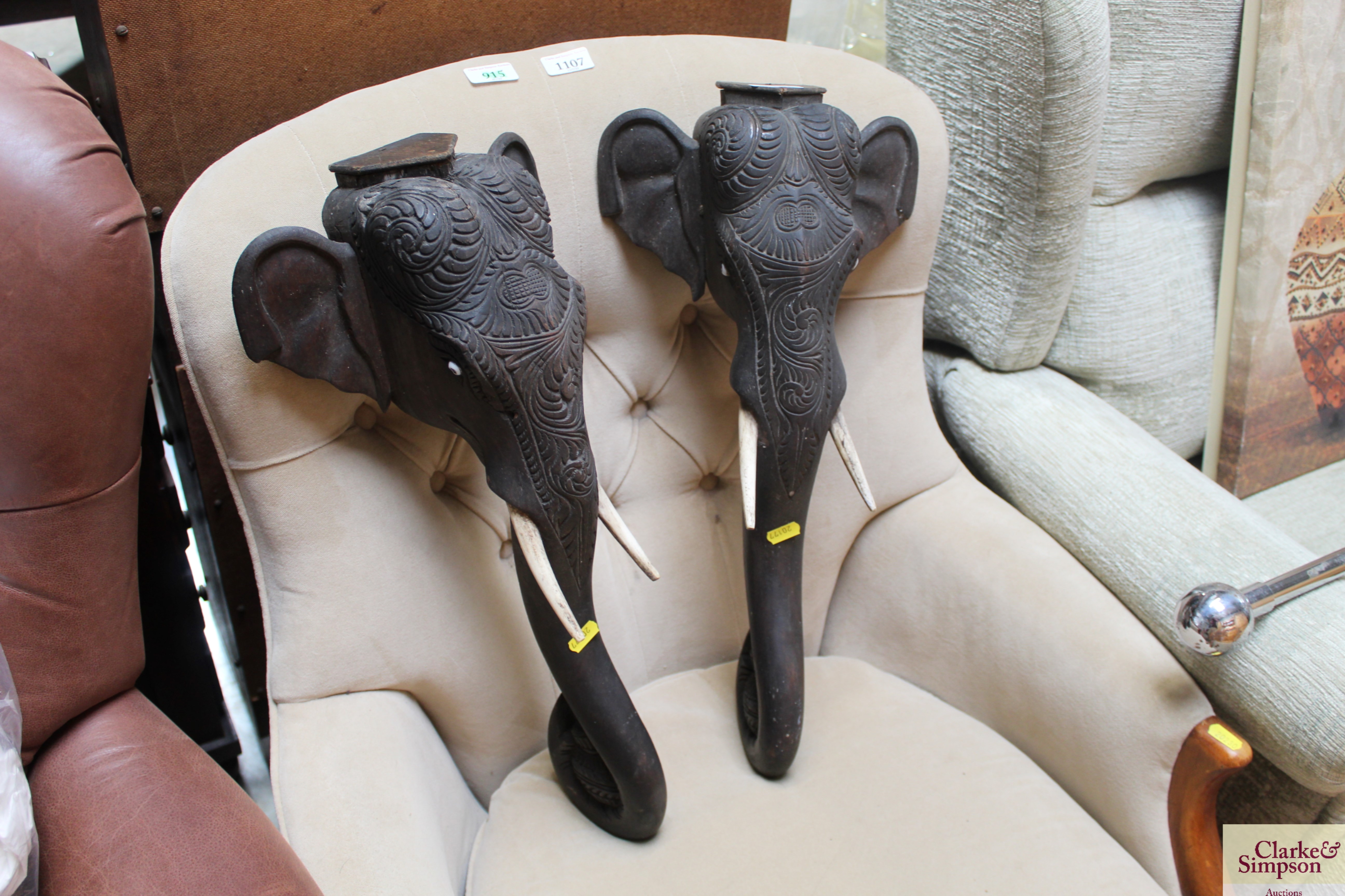 Two carved wooden elephant heads