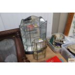 Two small upright glass display shelves