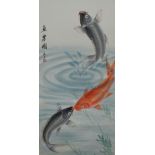 An Oriental painting on silk, depicting a leaping fish and two further fish below with signature and