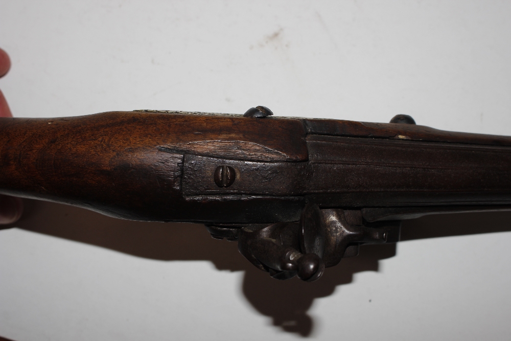 An 18th Century flintlock pistol, with brass mounts - Image 19 of 25